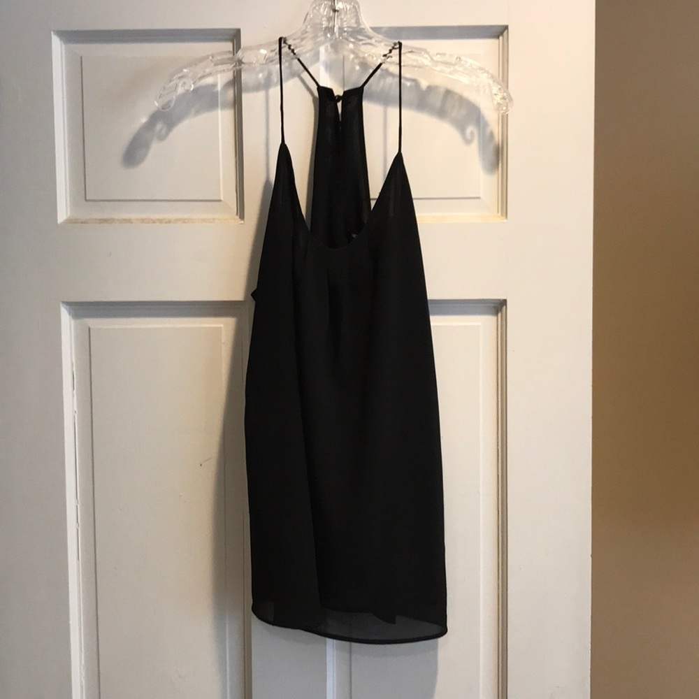 Black top with gold buttons on the back